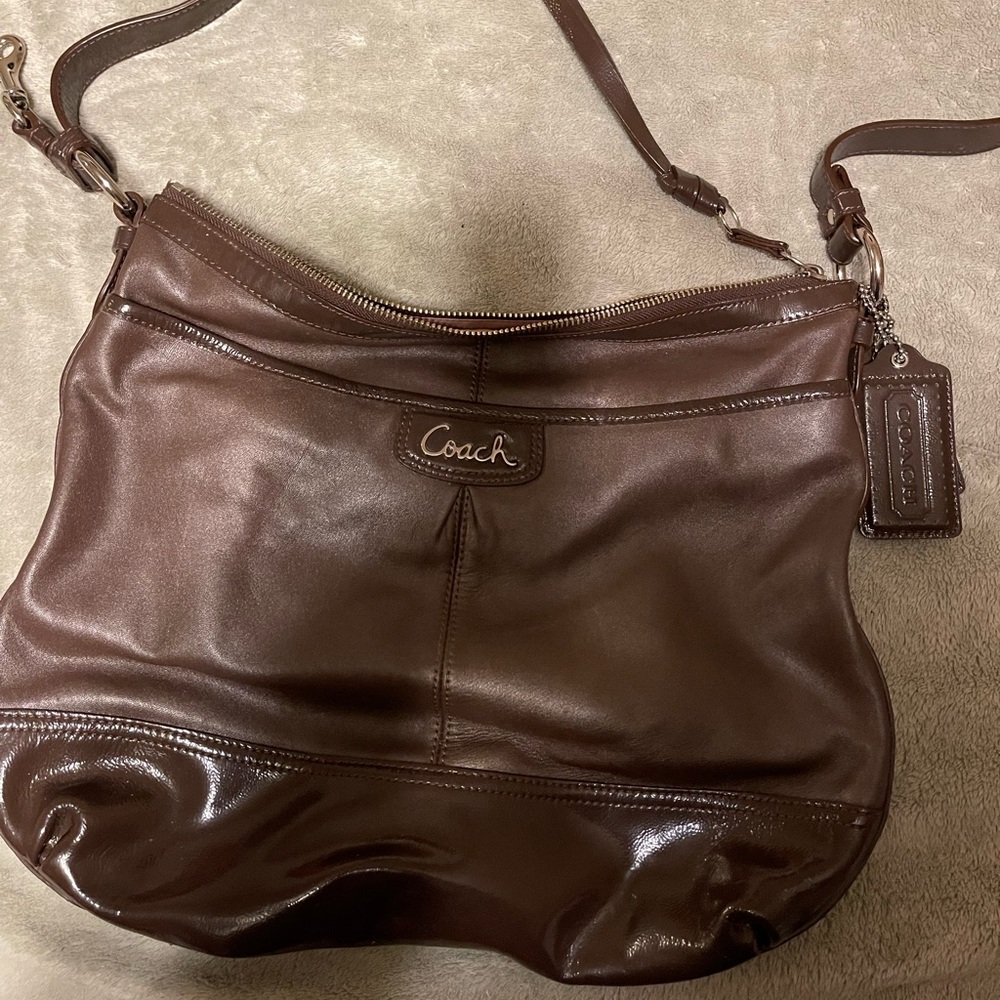 1 Brown Coach without tags in Excellent condition.